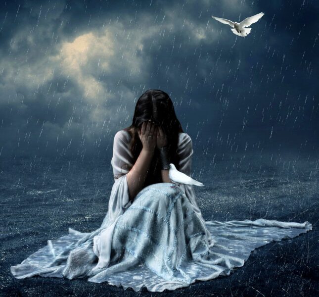 Hình ảnh cô gái buồn dưới mưa