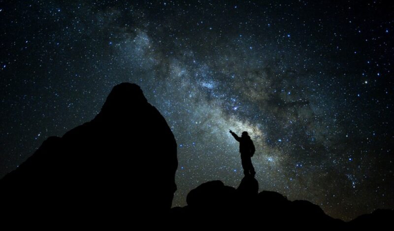 Man stargazing under the Milky Way in Alabama Hills, California, USA