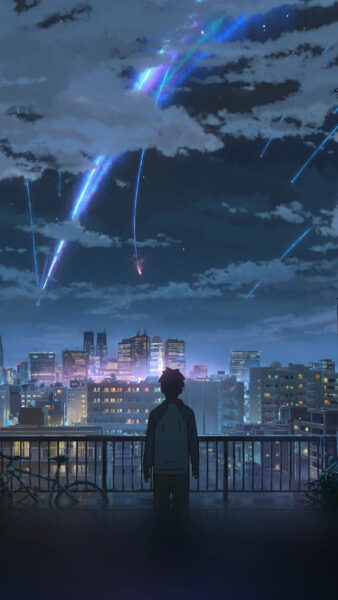 Ảnh Your Name đứng ngoài lan can, ngắm thành phố