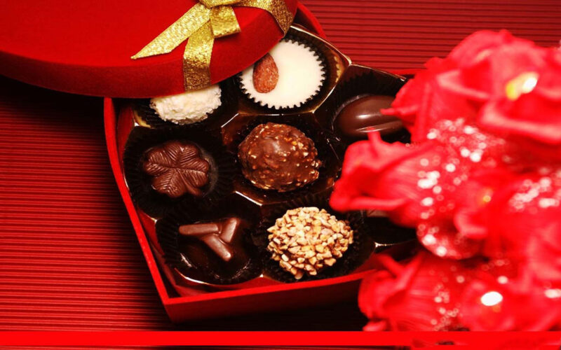 Valentinsschokoladenfoto im roten Herzkasten