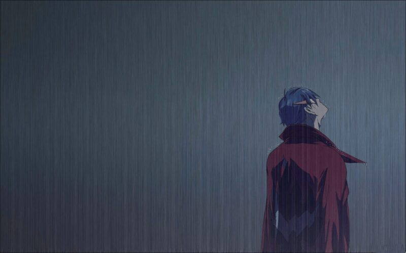 Hình ảnh hoạt hình buồn nam đứng dưới mưa