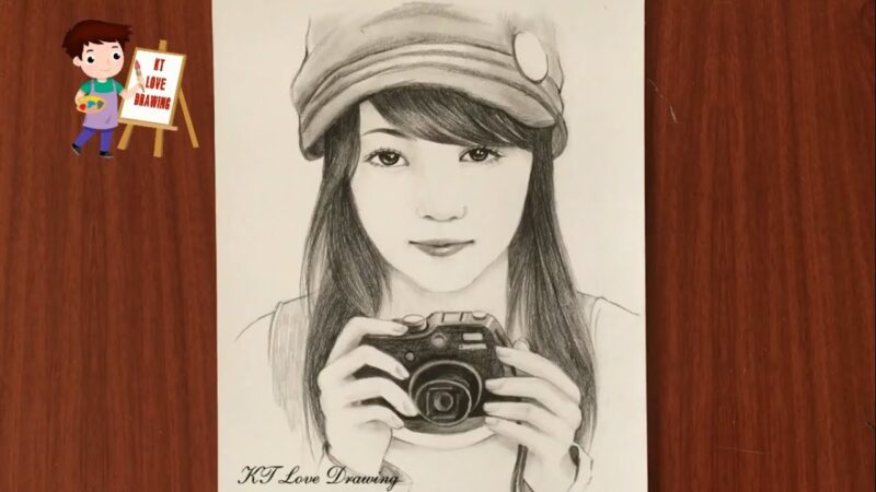 Hình vẽ con người tay cầm máy ảnh
